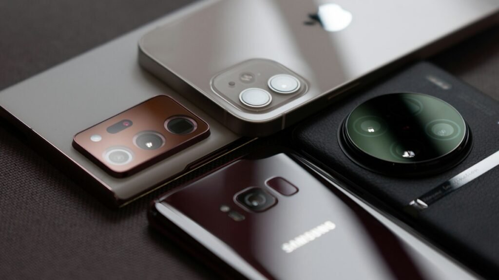 Group of new smartphones on a table representing upcoming phones this week